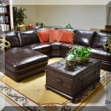 F01. Leather sectional with motorized reclining seats and chaise longue. Approx 3'h x 10'w x 10'l